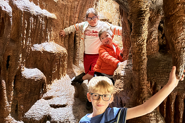Students walk through a rocky canyon