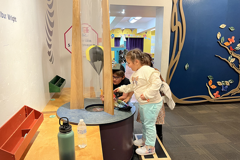 Students play with an air tube