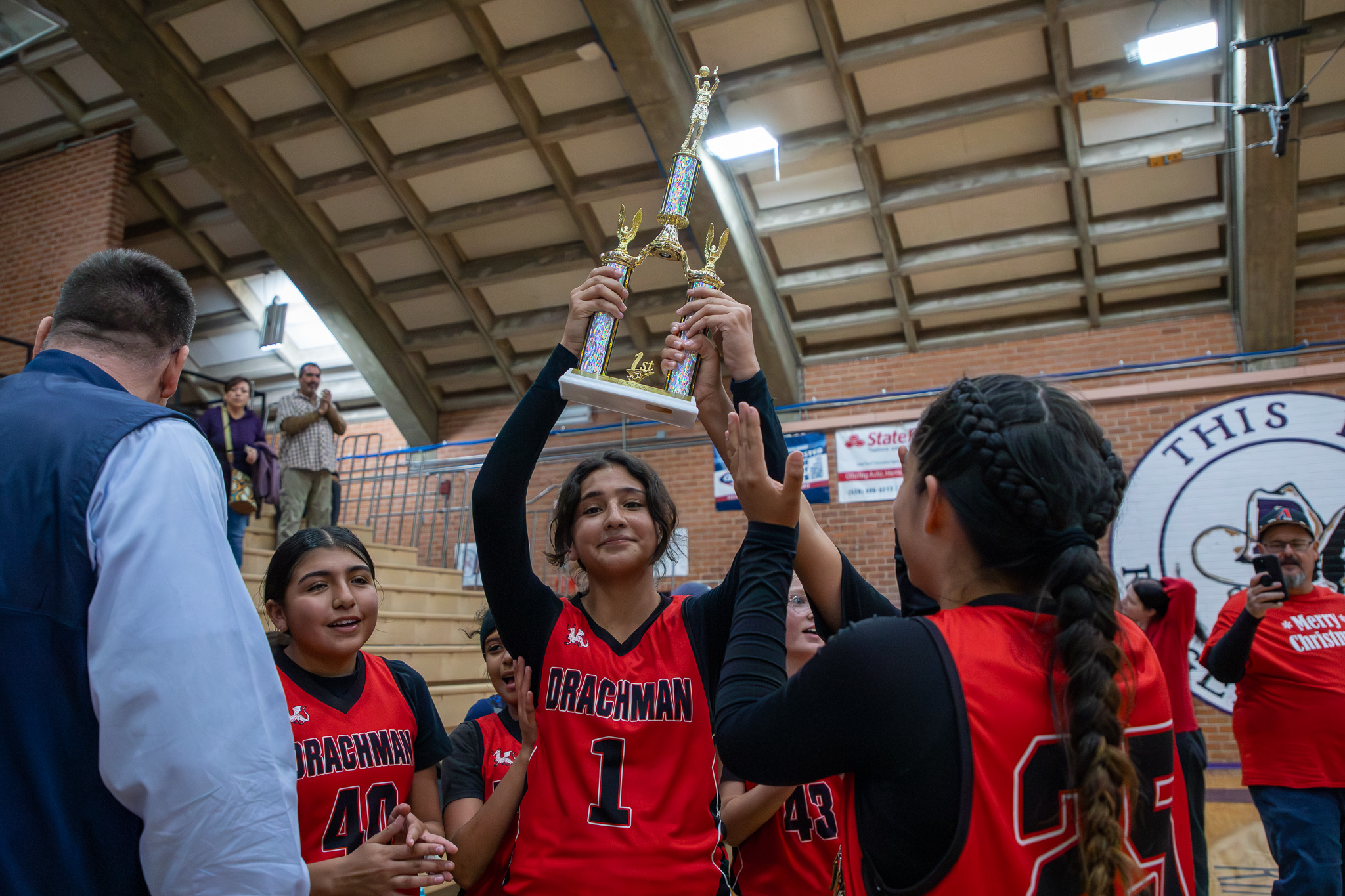 The Drachman girls' team holds up their trophy