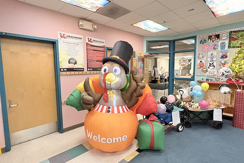 An inflatable turkey greets families in the library