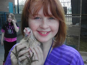 Student holding chicken